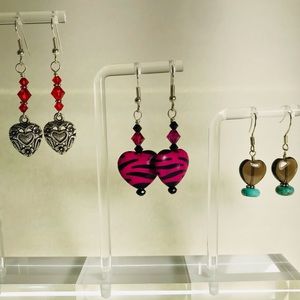 Three pair of handcrafted heart earrings.